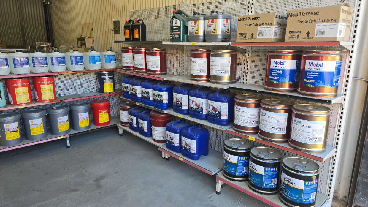 Wall of lubricant bottles and drums