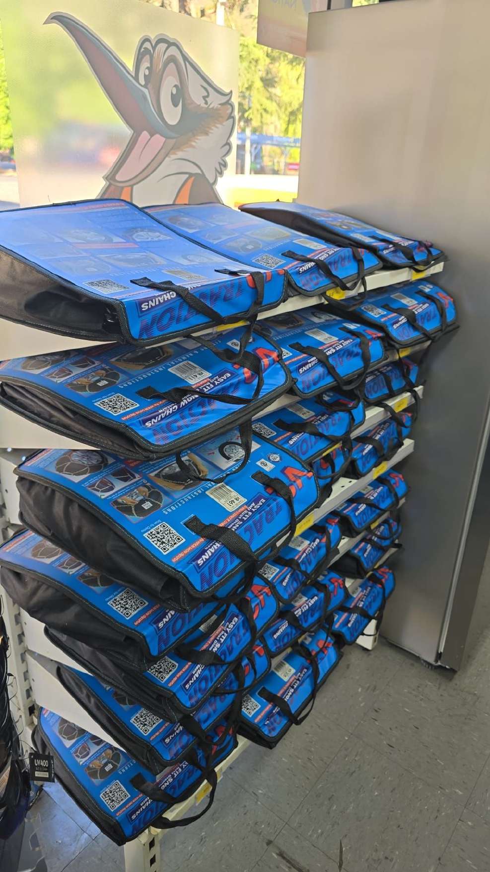 Travel bags on a store display rack